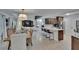 Open-concept living space with living room, dining area, and kitchen, perfect for entertaining at 706 Bunker View Dr, Apollo Beach, FL 33572