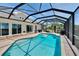 Inviting screened pool area with clear blue water and comfortable outdoor seating at 706 Bunker View Dr, Apollo Beach, FL 33572