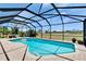Screened-in pool with a view of the big back yard at 706 Bunker View Dr, Apollo Beach, FL 33572