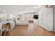 Bright bedroom with white furniture, modern desk, large window, and wood floors at 103 S Habana Ave, Tampa, FL 33609