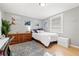 Cozy bedroom with light walls, wood floors, and a beachy decor at 103 S Habana Ave, Tampa, FL 33609