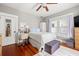 Comfortable bedroom featuring hardwood floors, natural light, and neutral tones at 103 S Habana Ave, Tampa, FL 33609