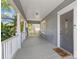 Inviting front porch with a 'hello' door mat, and a classic design at 103 S Habana Ave, Tampa, FL 33609