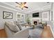 Comfortable living room features a fireplace, and bright natural light at 103 S Habana Ave, Tampa, FL 33609