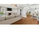 Comfortable living room flows into dining room with hardwood floors and fireplace at 103 S Habana Ave, Tampa, FL 33609