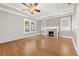 Classic living room features hardwood floors, a fireplace, and bright natural light at 103 S Habana Ave, Tampa, FL 33609