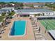 Aerial shot showcases community amenities including a pool, shuffleboard courts, and seating areas for resident enjoyment at 13225 101St St # 107, Largo, FL 33773