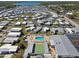 Aerial view of community with pool and shuffleboard courts surrounded by residences at 13225 101St St # 107, Largo, FL 33773