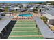 Aerial view of shuffleboard courts and swimming pool surrounded by community residences at 13225 101St St # 107, Largo, FL 33773