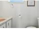 Bathroom with vanity, toilet paper holder, decorative artwork and a toilet at 13225 101St St # 107, Largo, FL 33773
