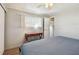 Cozy bedroom features natural light, a ceiling fan, and wood-look flooring at 13225 101St St # 107, Largo, FL 33773