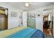 Bedroom featuring a closet, a door to a bathroom, and a door to the living area at 13225 101St St # 107, Largo, FL 33773