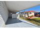 The covered carport offers sheltered parking with a privacy screen at 13225 101St St # 107, Largo, FL 33773