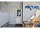 Welcoming entryway with a charming door and cozy outdoor seating area at 13225 101St St # 107, Largo, FL 33773