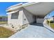 Exterior view of home with covered parking and well-maintained landscaping at 13225 101St St # 107, Largo, FL 33773