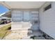Exterior view of the house with stone steps, an air conditioner, and well-kept landscaping at 13225 101St St # 107, Largo, FL 33773
