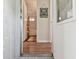 Hallway leading to a bathroom, complemented by stylish wood flooring at 13225 101St St # 107, Largo, FL 33773