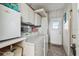 Functional laundry area equipped with a washer, dryer, and ample storage cabinets at 13225 101St St # 107, Largo, FL 33773