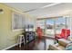 Comfortable seating area with hardwood floors, television, and an outside view at 13225 101St St # 107, Largo, FL 33773