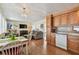 Open layout with adjacent kitchen and dining areas with ample natural light at 13225 101St St # 107, Largo, FL 33773