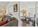 Inviting room with hard wood floors and an adjacent seating area at 13225 101St St # 107, Largo, FL 33773