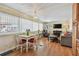 Bright living area boasts wood-look floors, dining table, and comfortable seating around a fireplace at 13225 101St St # 107, Largo, FL 33773
