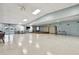 A wide-open meeting room showcases a stage, neutral walls, and plenty of natural light for large gatherings at 13225 101St St # 107, Largo, FL 33773