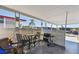 Patio with seating, a grill, and a protective lattice enclosure at 13225 101St St # 107, Largo, FL 33773