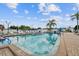 A relaxing pool with lounge chairs, umbrellas and clear blue water at 13225 101St St # 107, Largo, FL 33773