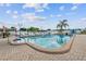 A relaxing pool with lounge chairs, umbrellas and clear blue water at 13225 101St St # 107, Largo, FL 33773