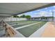 A shuffleboard court with shaded seating and well-maintained green surface at 13225 101St St # 107, Largo, FL 33773