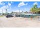 Charming commercial building with vibrant colors, picnic tables, and ample parking, perfect for community gatherings at 14612 Coral Dr, Hudson, FL 34667