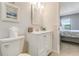 Clean bathroom featuring a white vanity with a mirror and a toilet at 15 Glendale St # B6, Clearwater Beach, FL 33767