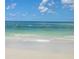 Waves crashing on a pristine white sand beach with turquoise ocean waters at 15 Glendale St # B6, Clearwater Beach, FL 33767