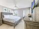 Comfortable bedroom with tiled floor, ceiling fan, and serene gray walls at 15 Glendale St # B6, Clearwater Beach, FL 33767