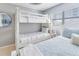 Bunkbeds and blue accents in a bedroom with good natural light at 15 Glendale St # B6, Clearwater Beach, FL 33767