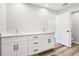 Bathroom featuring a double sink vanity with white cabinets and modern hardware at 15409 Coot Rd, Weeki Wachee, FL 34614