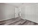 This bedroom features modern flooring, a closet, and a door to the kitchen at 15409 Coot Rd, Weeki Wachee, FL 34614