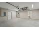 View of a clean and organized garage, providing ample storage and utility hookups at 15409 Coot Rd, Weeki Wachee, FL 34614