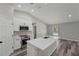 Open kitchen featuring a large island, stainless steel appliances, and modern finishes at 15409 Coot Rd, Weeki Wachee, FL 34614