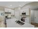Modern kitchen features white cabinets, stainless steel appliances, and a quartz countertop island at 15409 Coot Rd, Weeki Wachee, FL 34614