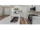 Well-equipped kitchen features stainless steel appliances, island and seamless flow into the living area at 15409 Coot Rd, Weeki Wachee, FL 34614