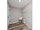 This functional laundry room includes a sink and hanging rack for added convenience at 15409 Coot Rd, Weeki Wachee, FL 34614