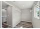 Walk-in closet with metal shelving and natural light from a window at 15409 Coot Rd, Weeki Wachee, FL 34614