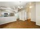 Open-concept dining room with tile floors and modern kitchen featuring stainless steel appliances at 15838 49Th N St, Clearwater, FL 33762