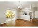 Open dining room with a sliding glass door to the yard and adjacent modern kitchen at 15838 49Th N St, Clearwater, FL 33762