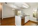 Modern kitchen featuring tile flooring, stainless steel appliances, and an eat-in bar at 15838 49Th N St, Clearwater, FL 33762