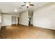 Open living space with tile floors, neutral walls, a built-in bookshelf, and a view to the kitchen at 15838 49Th N St, Clearwater, FL 33762