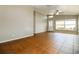 Bright living room featuring tile flooring, neutral walls, ceiling fan, and a large window at 15838 49Th N St, Clearwater, FL 33762