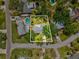 Aerial view of the property, showcasing its prime location, lush landscaping, and proximity to neighborhood amenities at 1666 N Dakota Ne Ave, St Petersburg, FL 33703